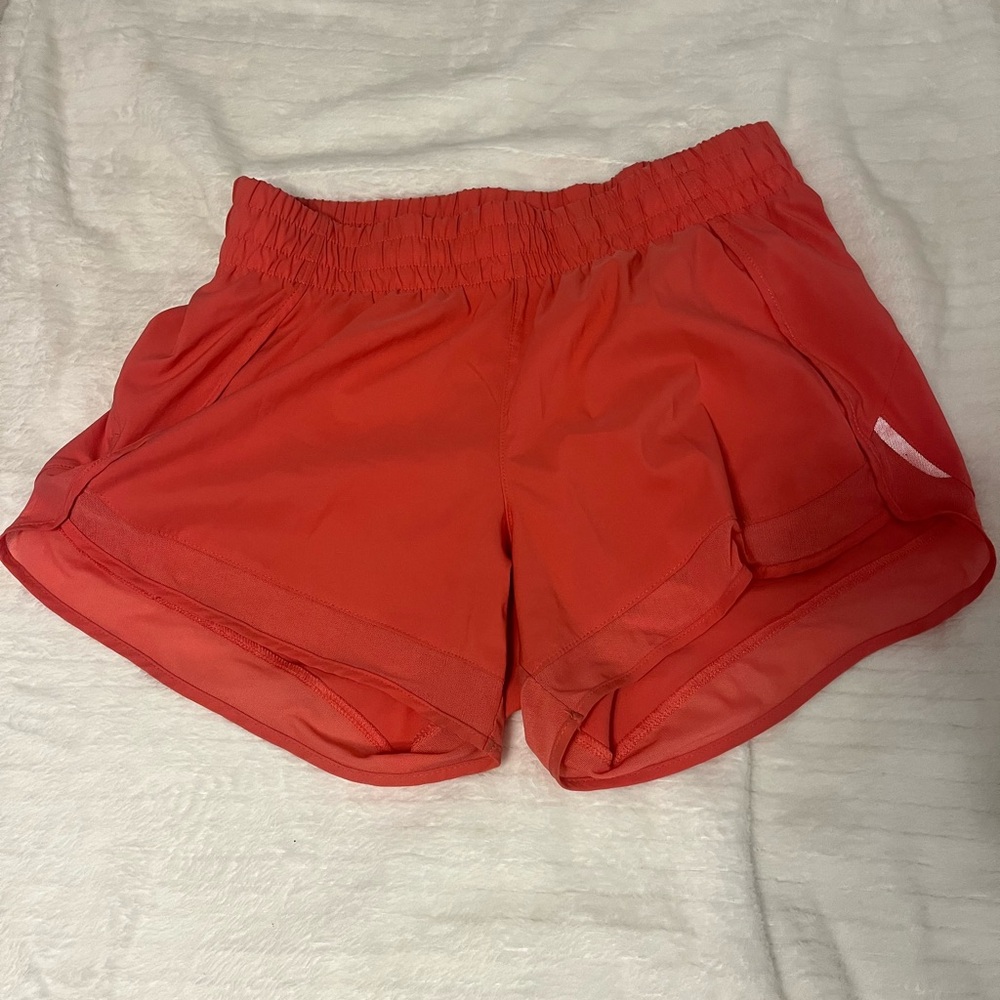 Athleta Racer Run shorts size xs, but fit a little bigger. Color coral
